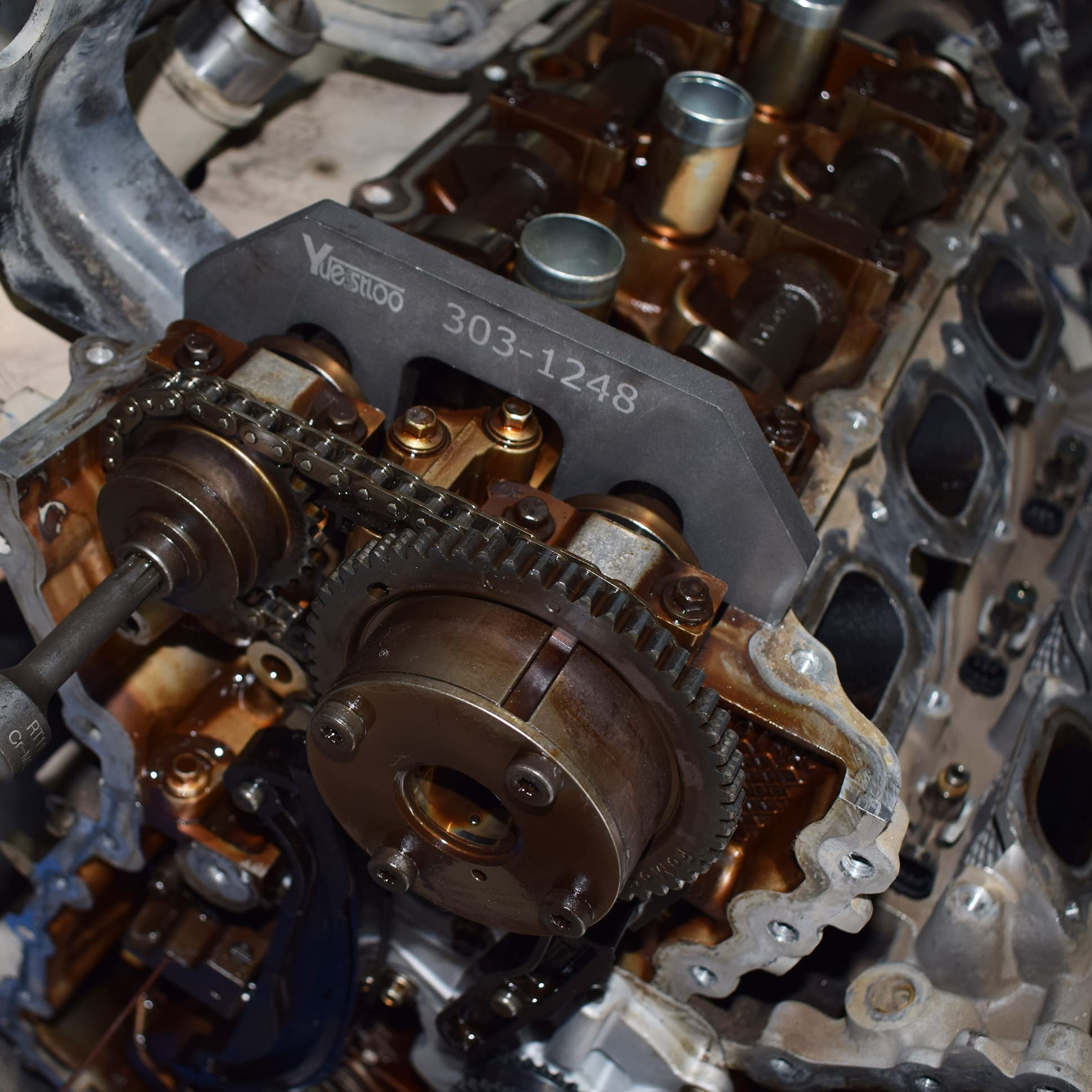 Camshaft screw removal tool for safe disassembly during timing tasks.