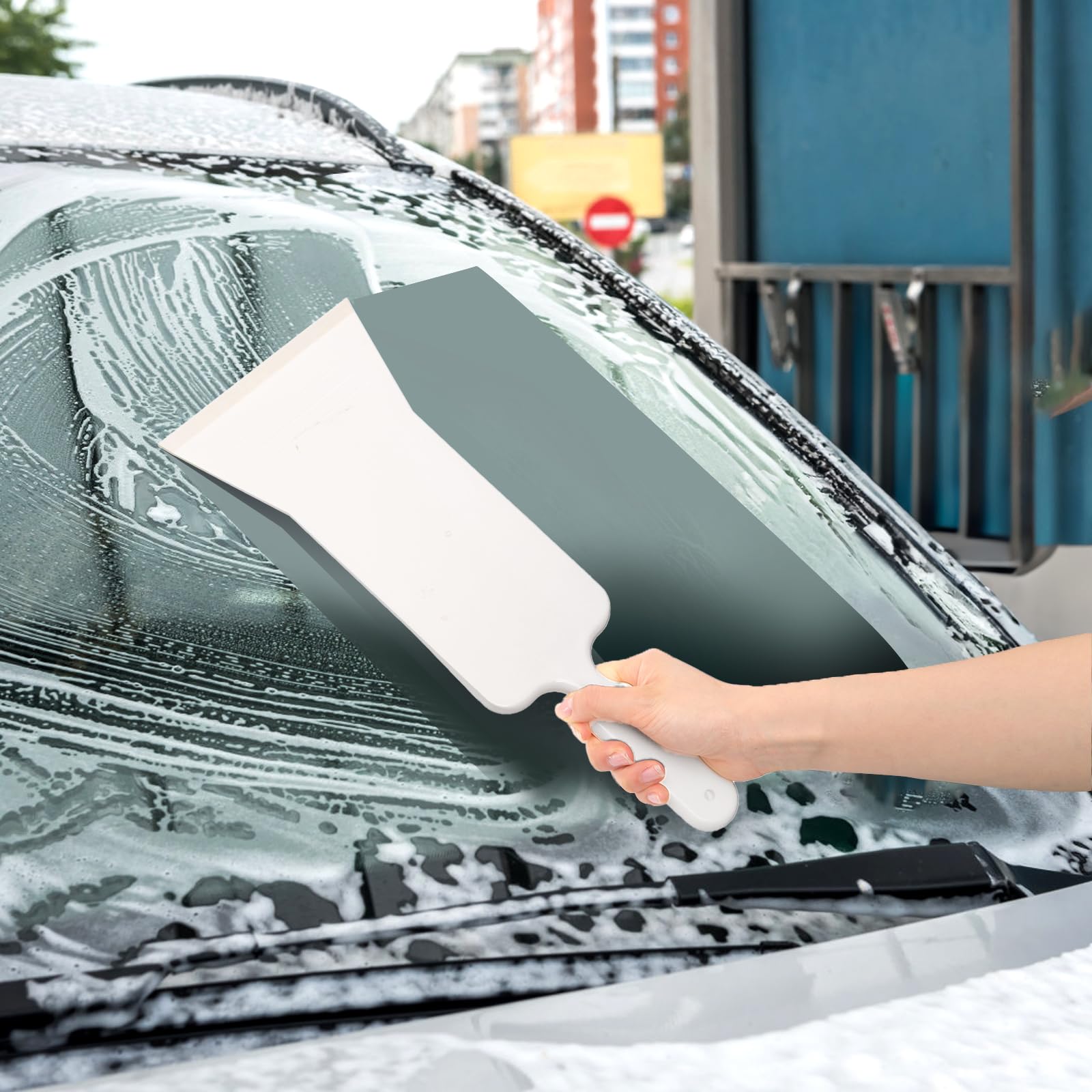 ZAVOOS green plastic-edge squeegee reaches tight corners easily.