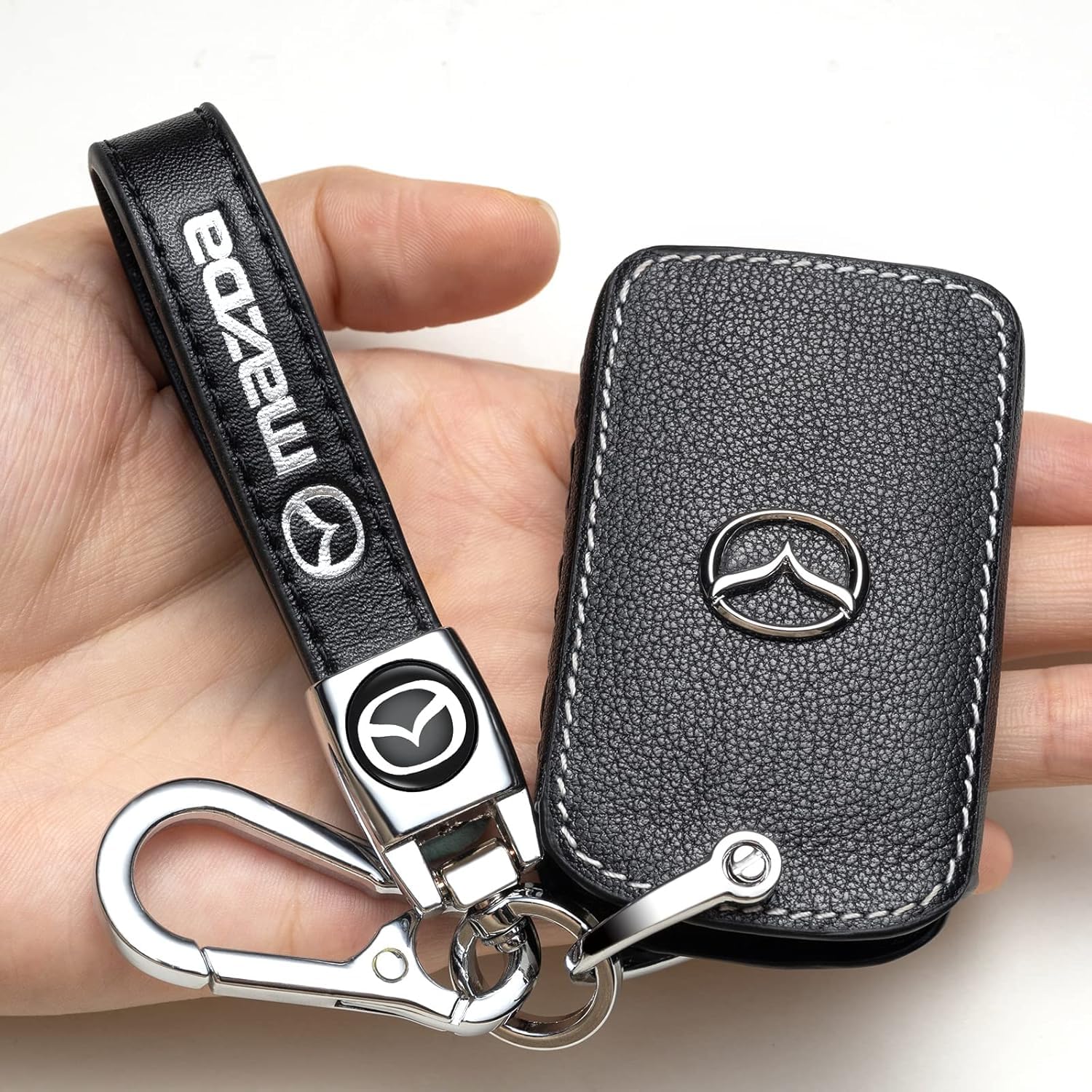 Close-up view of premium leather and metal hardware on ZERAL key case