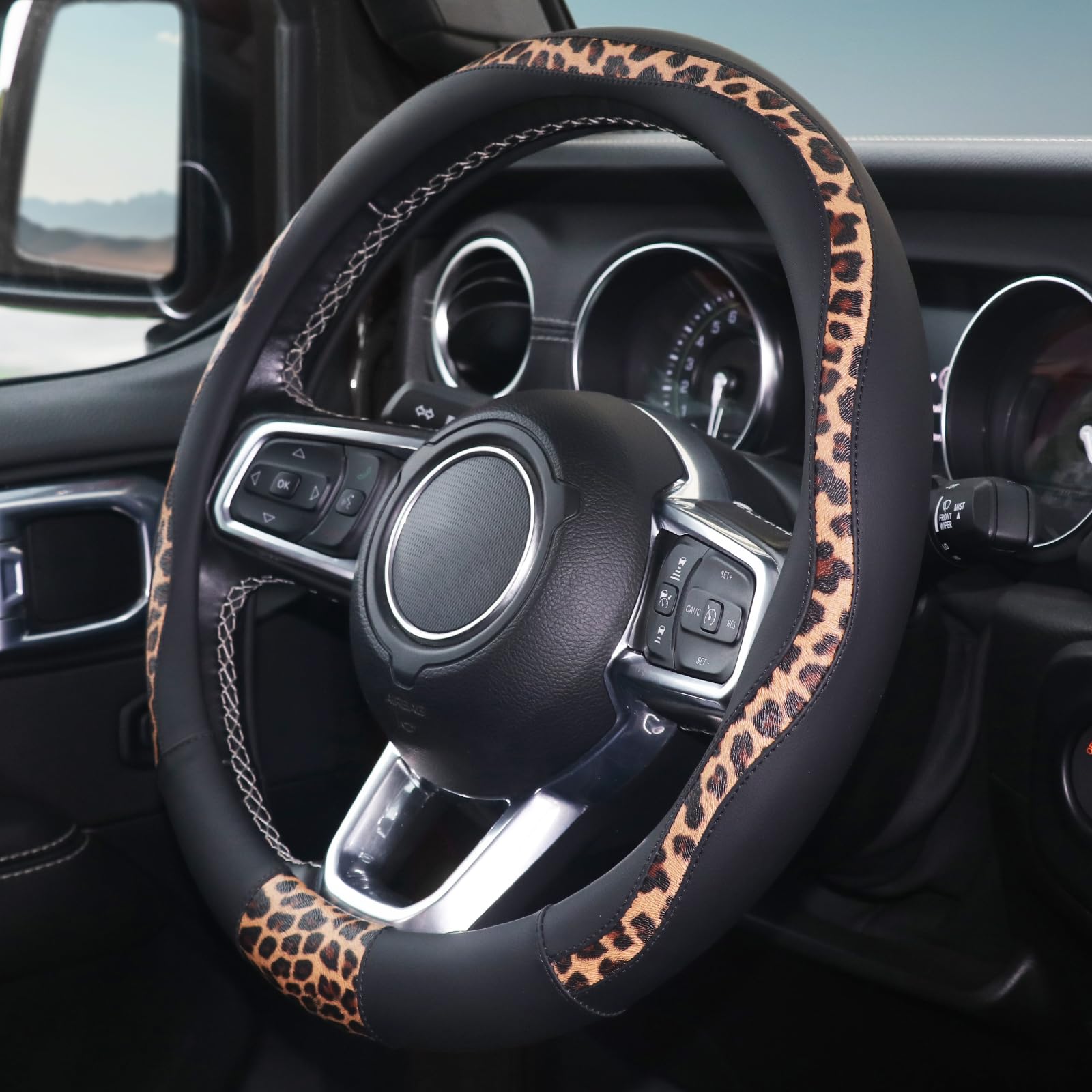 ZHOL leopard-print steering wheel cover on wheel enhances interior style.